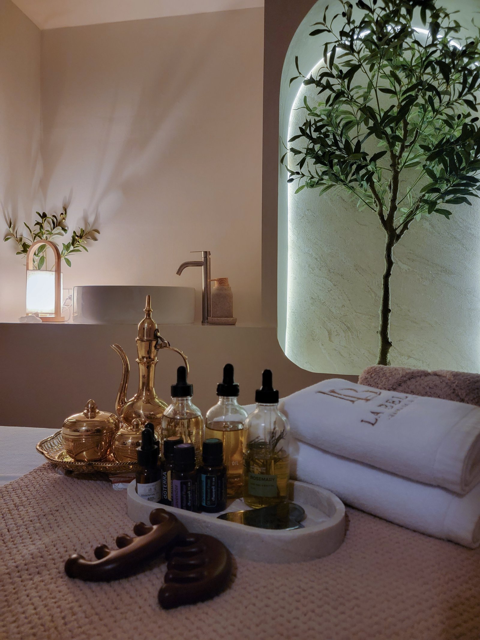 Serene spa treatment room with soft lighting and towels